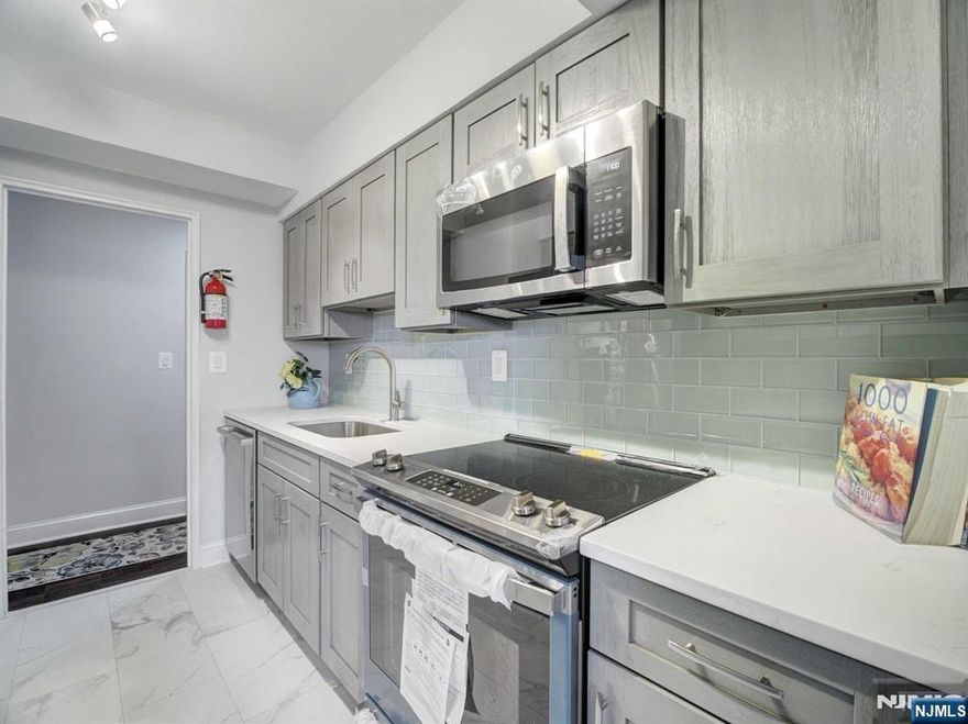 Did someone say balcony overlooking the garden? Come Home to another meticulously done gut renovated 5th floor unit. This 2 bedroom, 2 bath COOP and is for owner occupancy only. The new owner will enjoy a primary WIC and ensuite in addition to their private outdoor space. This 5H unit in a luxury high rise Harrison Park Towers has a beautiful new kitchen with high end appliances, 2 new baths, a large primary bedroom, second bedroom that enjoys a similar peaceful West facing view, and beautiful dark natural wood floors. This popular Coop features a 24 concierge, included utilities (electric, heat, hot water), underground parking ($60/mo) - just 1 space available, comp jitney to the NYC train and grocery stores, a backyard mature "secret garden", first fl gym and bright, clean basement laundry. Just blocks from access to GSP and Route 280, this is one of the best buys in Essex County! Coop board approval req and 20% down payment is a requirement. Shares 340 Maint 1550 (incl utils)