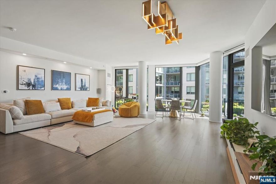 Experience luxury living at 9 Avenue at Port Imperial, Apartment 517, featuring breathtaking views of the NYC skyline. This spacious home offers an open-concept layout with floor-to-ceiling windows, a modern kitchen with stainless steel appliances, and elegant finishes throughout. Enjoy top-tier building amenities, including a rooftop terrace, fitness center, outdoor pool, and 24-hour concierge. Conveniently located steps from the NY Waterway Ferry, this waterfront gem provides quick access to Manhattan, nearby parks, shopping, and dining. A storage unit is also included in the sale! Schedule your tour today!