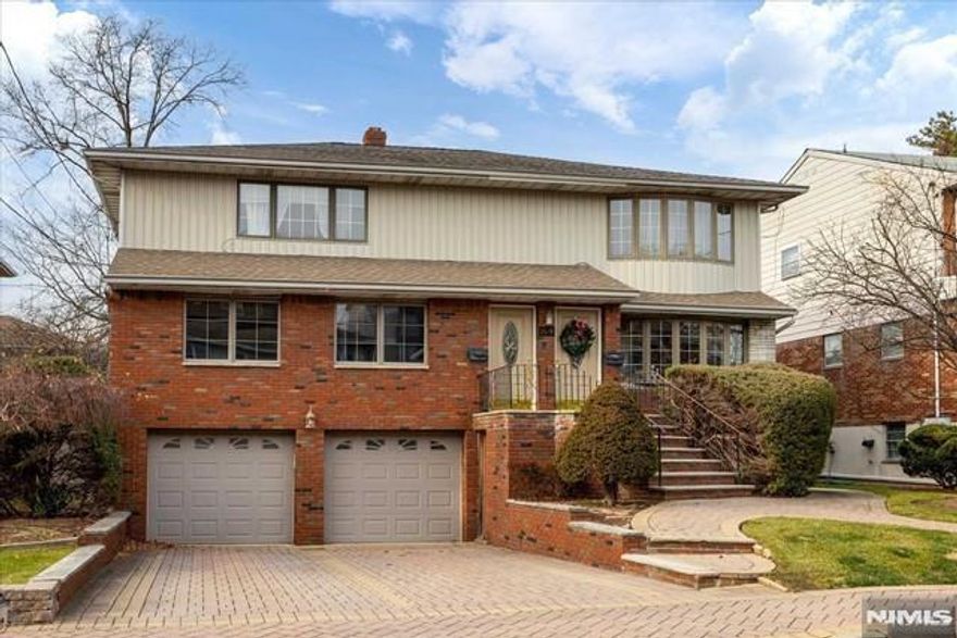 Excellent Location! Quiet No Thru Street! Super Convenient to NYC & local buses, Middle school, parks, & recreation center. very Spacious and lot of sunlight home, completely renovated, huge two bedroom and eat in kitchen. lots of closet space. All replaced windows, double sinks in the bathroom. hardwood floors, Separate utilities (gas heat/electric). Water included. Separate entry. freshly painted, Separate W/D for each tenant with access through a heated garage.