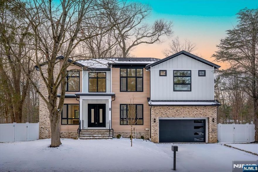 Brand New Construction by NJGCB, a leader in Modern Architecture and Design. HOME UNDER CONSTRUCTION - WORK WITH BUILDER TO SELECT FINISHES. Contemporary Style meets Luxurious Living in this stunning Custom Smart Home with over 4,600 sq ft of livable space spanning three levels. An Impressive Home with Grand Foyer, Floor to Ceiling Windows & Modern Glass Staircases. First Floor w/10ft Ceilings, Formal Living Rm & Formal Dining Rm w/ Butler's Pantry. 2-Story Family Room w/ 18ft Ceilings, skylights, Gas FP & Sliders leading to Outdoor Entertaining, including Deck, Covered Paver Patio and Stone Gas FP. A thoughtfully appointed Gourmet Kitchen w/ High End SS Appliances, Walk-in Pantry, Custom Cabinetry & Large Island w/Quartz Waterfall. Private First Floor Guest Suite w/ Bedroom & Full Bath. Mudroom & Powder Room complete first floor. Second Floor w/9ft Ceilings includes a Luxurious Primary Suite w/tray Ceilings, Private Balcony, Custom WIC's & Spa Bath w/soaking tub, Heated Floors, Dual Vanity & Water Closet. Three Large Guest En Suite Bedrooms, Separate Home Office & Laundry Room. Finished Walk-out Basement w/ 9ft ceilings, Bedroom, Bath, Media Room w/ Soundproofing & Speakers, Rec Room w/ Wet Bar & Appointed Gym w/rubber flooring & mirror wall. Landscaping includes Sod, Irrigation System, 6ft Privacy Fence, BBQ Gas Line. Plenty of room for Future Pool. May 2026 Completion. Pictures are from 47 Falcon Road which has similar layout and finishes.