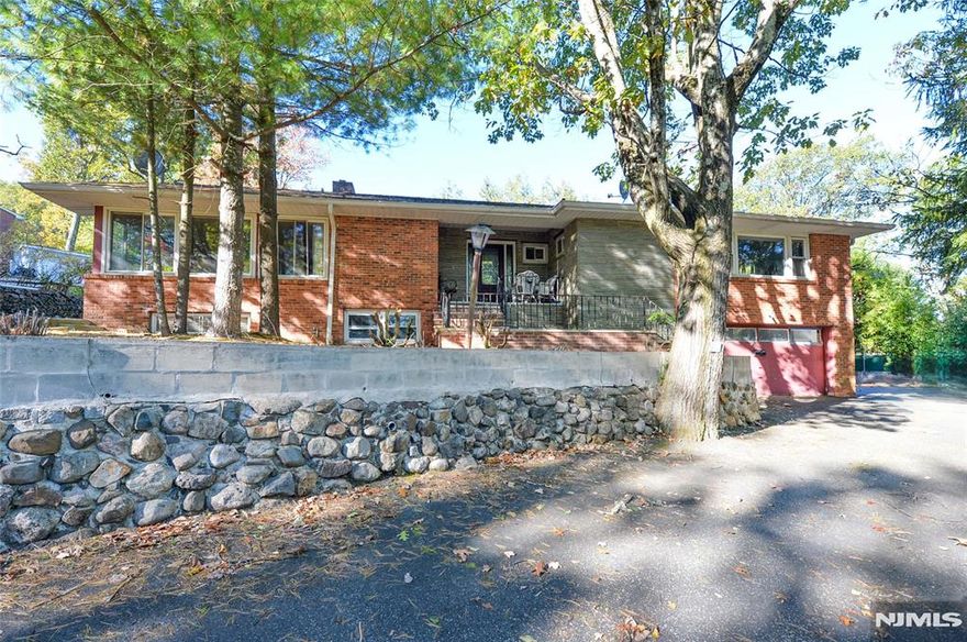 Very large Ranch in the pleasantdale section of West Orange, vacant and ready for immediate occupancy. Located on a corner lot that is approximately 16,000 square feet, with a large side yard. Great home for entertaining with 2 driveways, multiple patio areas, a walkout ground floor with summer kitchen, and a great layout with so much potential. The home has 3 bedrooms on the main floor, including the primary bedroom and primary bathroom that has been recently renovated. The hall bath is a great size with large tub and needs updating. The eat in kitchen with a door to the back patio is ready for updating and customization. This floor also has a formal living room and dining room, family room, and an enclosed patio/3 season room. with access to the rear patio. The basement is hardly a basement as most of it is above ground, with so much space, including the huge converted garage that now adds to the square footage on this floor. there are a total of 5 rooms on the ground floor, with potential for extended living and a separate entrance off the summer kitchen. The home has great bones, and with some tlc can be one of the highest value homes in the neighborhood. Truly a great opportunity.