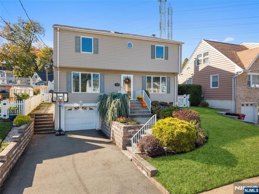 Welcome to this beautifully detailed home nestled on a quiet residential street near a highly rated elementary school. Set on an oversized lot, this property offers incredible space inside and out. Step into a large living room with powder room that has walkout to the back deck. Adjacent formal dining room has custom gas fireplace. Each room is enhanced by elegant crown molding and timeless design touches. The updated kitchen impresses with bright white cabinetry, a large island with seating, and a separate dining nook overlooking the expansive backyard. Upstairs, the primary suite features high ceilings, a walk-in closet, and a private bath, while two additional bedrooms share their own bathroom. The finished basement adds even more living space with stylish finishes and a convenient half bath that is ideal for a rec room, gym, or play area. Sliding doors lead to a large Trex deck and a huge, fenced-in yard with plenty of green space for entertaining or relaxing. Easy commute to NYC transportation, ON3 campus and major highways. Move right in and enjoy a home that blends thoughtful detail, modern updates, and that perfect suburban lifestyle.