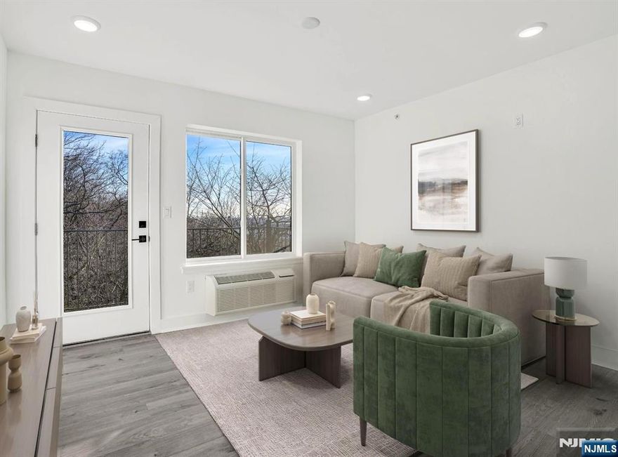 LAST AVAILABLE UNIT IN THIS LINE. Top floor corner 1 bedroom plus den with window, 2 full baths, and terrace in a new construction elevator building with Meadowlands views and abundant natural light. Meadowview Residences is a 12-unit building with open exposures on all sides. This flexible layout offers open concept living, modern kitchen, and in-unit laundry. Private terrace and convenient access to public transportation to Manhattan. Premium indoor garage parking with easy maneuverability available.