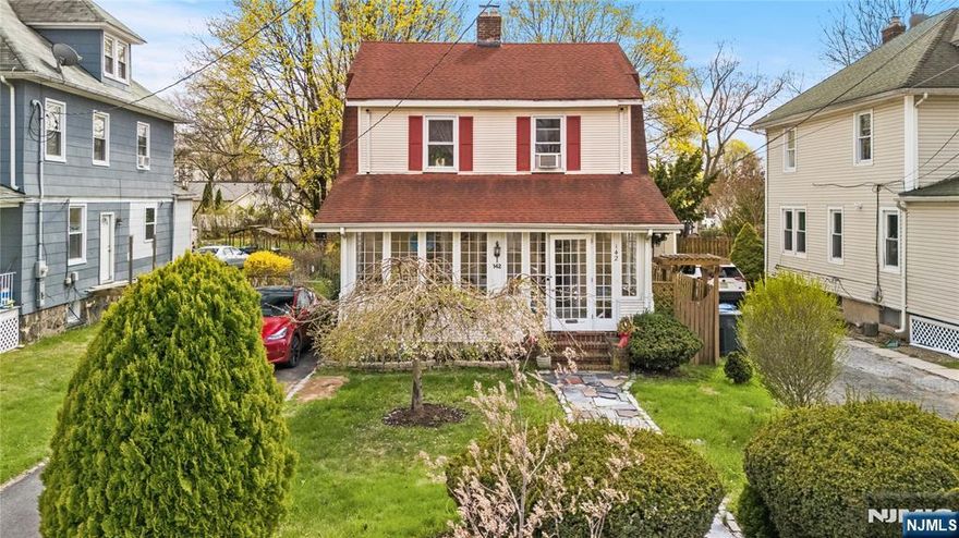 BOM! Charming Colonial in Englewood offering warmth, sunlight, and convenience just minutes from NYC. Welcome to this lovely 3-bedroom, 1.5-bath home where an enclosed front porch leads into a bright living room with a cozy fireplace, flowing into a dining room and an eat-in kitchen filled with natural light. Upstairs you'll find three comfortable bedrooms and a full bath, while the half-finished basement provides additional living or storage space. Outdoor living is easy with a backyard deck, detached garage, and ample parking. Perfectly located near shops, restaurants, schools, parks, and public transportation with quick access to NYC, this home combines warmth, functionality, and convenience in one inviting package.