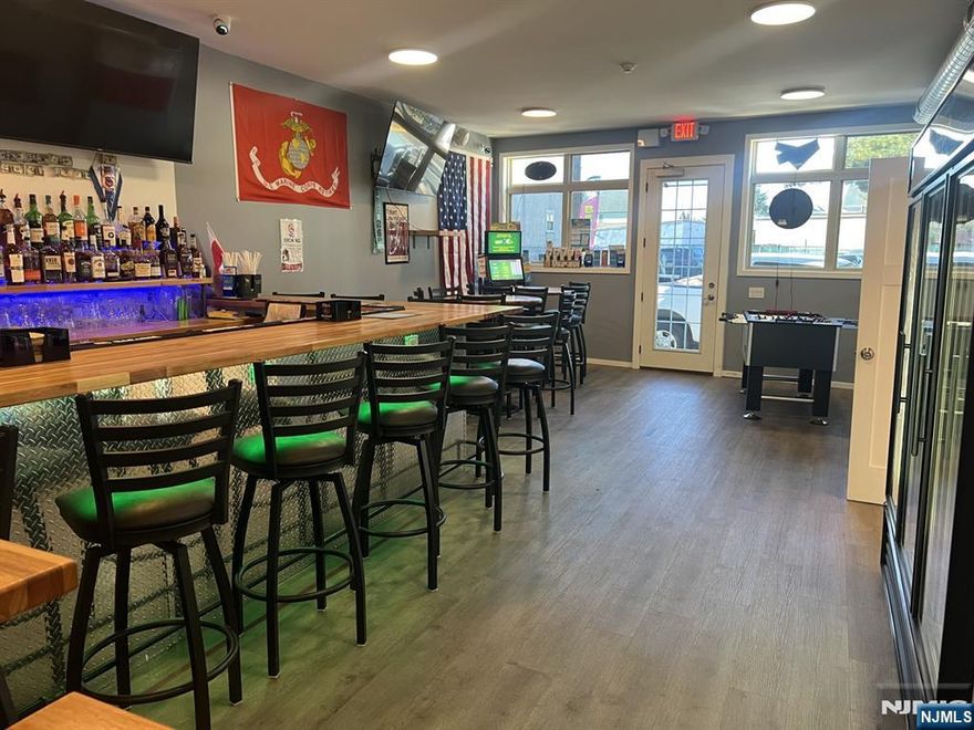 Lease at $2,000/mo (all in number, including CAMS and taxes) Renovated Bar +/- 800 SF Main Level plus =/- 800 SF full size basement , perfect for storage and any prep (if the buyer chose to add a small kitchen). According to the sellers, adding a kitchen would get approved, just need to go through the permitting process. 10 ft. ceilings on main level. Ideal for restaurant/bar, salon, office space, and other retail. Owner willing to entertain an option on the property. Landlord holds package liquor license, willing to sell under separate transaction, asking $200,000.