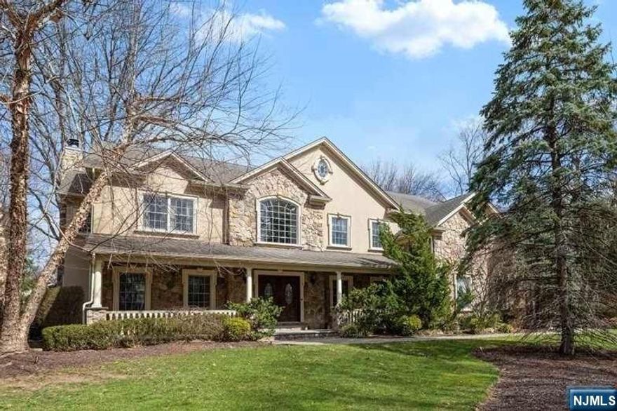 Welcome to your forever home, blending luxury & comfort on the sought-after west side of Montvale. Step through the inviting front porch into the two-story entryway of this stately 5BR Center Hall Colonial, with elegant formal rooms off the foyer. A gourmet EIK with center island leads into the Family Room with custom built-ins, fireplace and wine bar. Oversized windows and sliding doors overlook the expansive flat backyard. Main level also features powder room, 5th BR w/adjacent full bath, ample closets & storage. Retreat upstairs to your luxe primary suite featuring vaulted ceilings, sitting room w/gas FP, two custom WICs, and spa-like bathroom. A dreamy 2nd suite offers private bath + bonus dressing room. Two more ensuite BRs, upstairs laundry, & a lg bonus room. Basement multi rec areas, half bath, gym, storage & backyd access. 3 car garage, whole house generator. Close to NYC Express Bus, GS Pkwy & I-287; Free busing to Montvale K-8 Schools. You will love this house!