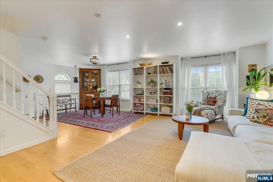 The best kept secret in Montclair! This spacious, light-filled, end unit is beautifully updated, move-in ready and nestled in the middle of a private park, right in the center of vibrant Downtown Montclair! The eat-in Kitchen (updated in 2024) is spacious and bright, with loads of cabinetry, stainless steel appliances and access to the large, private balcony. The open concept Living and Dining spaces are warm and inviting, filled with light from the oversized windows and centered on the wood-burning Fireplace. The updated Powder Room and separate Laundry Room round out the living level. Three spacious Bedrooms upstairs include the Primary Suite, with en suite Bath and walk-in closet. Customized Elfa closet systems plus roomy attic offer plenty of storage. The 7+ acre grounds are lushly landscaped with walking paths, playground, gazebo and picnic areas. And it comes with 2 parking spots! All this, just a stone's throw from Lackawanna Plaza (home of the Montclair Flea), Bay Street Station (7 day/week NYC train) and the endless restaurants, shops and galleries of Downtown Montclair. Plus Walnut Street (Farmers' Market, more restaurants, more shops) is only a half mile away. It just doesn't get better than this!