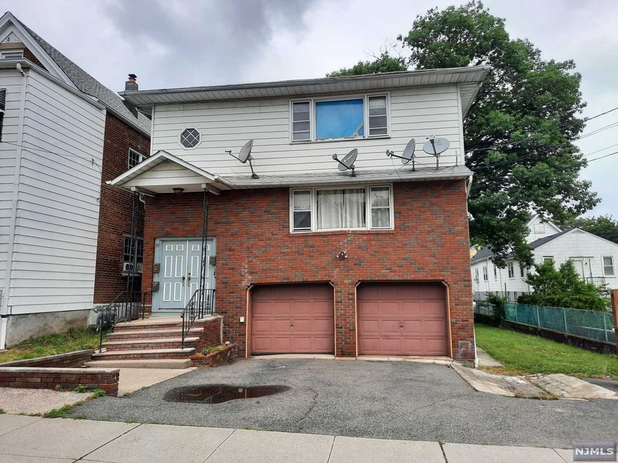 Great investment opportunity... large two family home located in Garfield. Both units have spacious living rooms, eat in kitchens, 3 bedrooms on each floor and a full bathrooms. House have lots of closet space and hardwood floors. This home also features an attached two car garage,graund level family room, office , full bathroom, bonus room, laundry room, huge shed and fenced backyard. Call now to schedule your appointment!