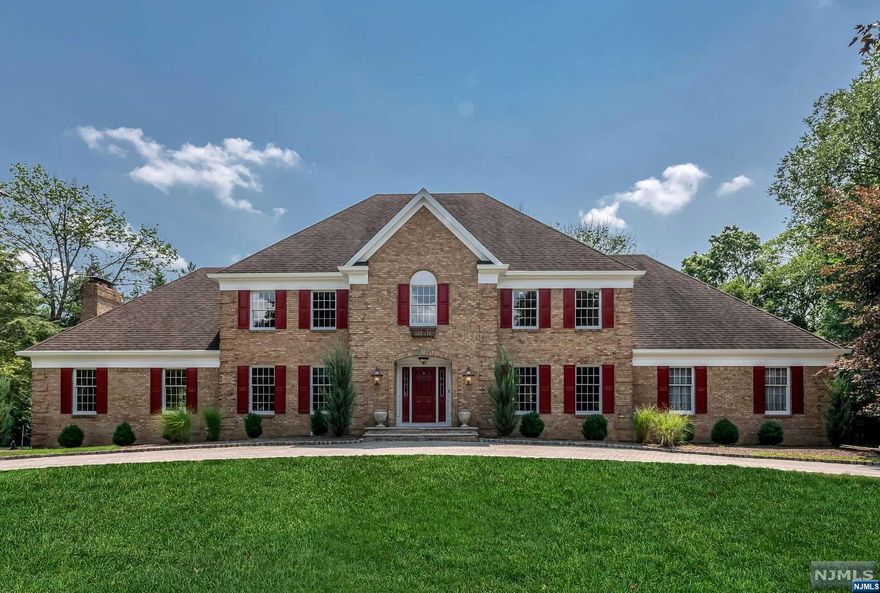 Perfectly located in Lily Pond Estates, the circular driveway introduced a classic brick center hall colonial that's perfectly proportioned with captivating spaces that make entertaining a breeze. The updated kitchen makes a statement with huge center island, breakfast area and open access to the GR w/trayed ceiling, commanding fireplace and wet bar. French doors give easy access to an expansive deck across the back of the home that overlooks the heated salt water pool and an acre of flat lawn, gazebos and gardens. Formal LR/Billiard Rm, DR and Laundry Rm complete the first fl. Upstairs find the Primary Suite with a sitting room/office or add'l Br/Nursery, WIC and Luxe Bath. Beyond find 2 more BR's, a hall bath and a Jr/Guest Suite with bath and private staircase to the first floor. The LL is fully finished w/ fitness rm, game area, media, workshop, huge cedar closet, storage room and staircase to 3 car garage! A classic and spectacular home to enjoy for years to come!