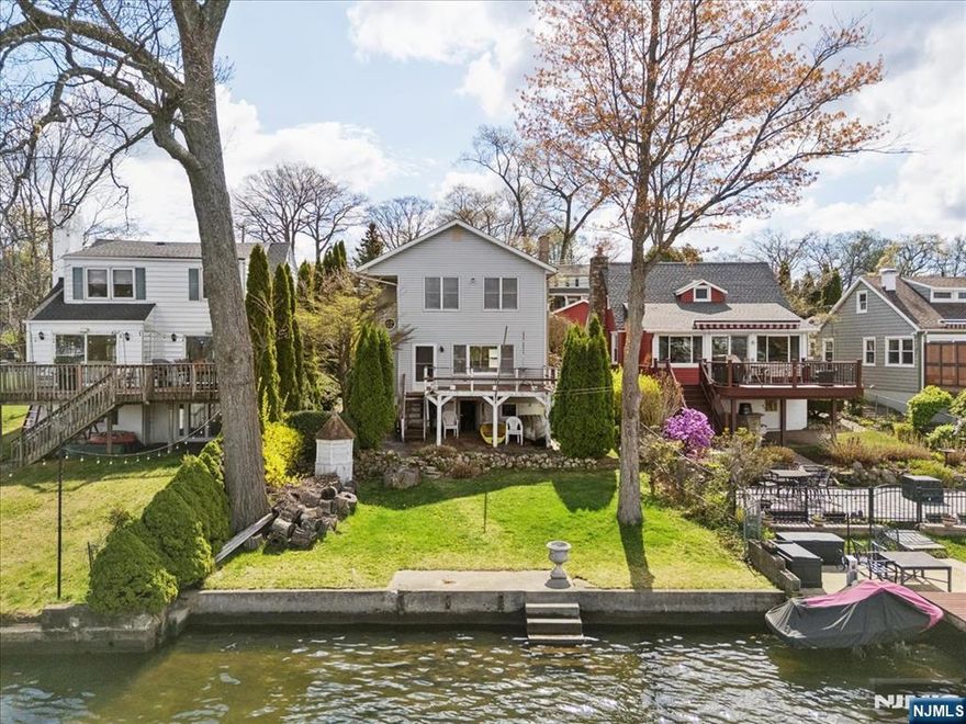 Positioned in one of the most desirable locations on the lake sits a rare opportunity to own lakefront property on Bertrand Island in Lake Hopatcong. Offering breathtaking sunset views from your backyard, this 3-bedroom home features 1 full bath, 1 half bath, and a 1-car garage. Ideal for year-round living or a weekend getaway, this property offers the rare chance to secure a prime piece of waterfront real estate and transform it into something truly special. It's the perfect canvas for your dream lakefront retreat. 1st floor offers an open-concept layout with a seamless flow between the living room, dining area, and kitchen, all opening to a deck that captures stunning lake views, ideal for entertaining or simply enjoying the sunsets. A convenient laundry area and powder room complete this level. Upstairs, you'll find 3 bedrooms and a full hall bath, providing comfortable living space for year-round use or weekend escapes. The home also features a walkout basement, offering additional potential for finishing or storage. Outside, enjoy ample yard space perfect for relaxing, entertaining, or taking in the picturesque sunsets, along with the opportunity to build a dock for your boat and fully embrace lakefront living. A rare find with endless potential for investors or buyers looking to create the ultimate Lake house. House is sold completely as-is, it is your opportunity to own this rare property on the lake.