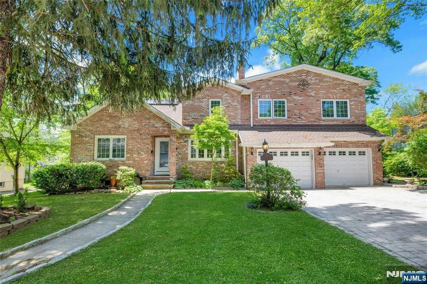 Welcome to this exceptional custom-designed brick home featuring 6 spacious bedrooms and 4 full baths. Designed for comfort and flexibility, the layout is perfect for both everyday living and entertaining. Step into a warm living room with a charming wood-burning fireplace. The adjoining dining room and den boast dramatic double-height ceilings, a gas fireplace, and elegant tray lighting that fills the space with light and character. The 2nd floor offers four generously sized bedrooms and two full baths, providing privacy and space for family and guests. The first floor includes two additional bedrooms and full baths, ideal for multi-generational living or a home office setup. Outside, enjoy a covered, paved patio perfect for entertaining in any season, plus a shed/garage for extra storage or workspace. Located in a quiet, desirable neighborhood within walking distance of St. Cloud Elementary School, and minutes from the South Mountain Recreation Complex, offers easy access to NJ Transit with direct service to NYC.