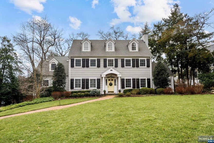 Pristine Center Hall Colonial in the heart of Ridgewood's Old Country Club section. Nestled on a picturesque 3/4 acre, this exceptional 6 bedroom, 5.5 bath offers 6,100SF of unsurpassed quality, style and curb appeal. Spectacular flow throughout the light and bright main level with hardwood floors, volume ceilings, and an open layout between an eat-in kitchen and family room at center stage. Kitchen features high-end stainless steel appliances, an oversized center island, and overlooks a family room with fireplace and tray ceiling. Expansive living room with fireplace, formal dining room, home office, and laundry complete the 1st level. Five bedrooms total on 2nd level, including a sizable primary suite and secondary ensuite. Highlights include a 1,300SF finished basement with full bath & 9-ft ceilings, a private level yard, and oversized 2-car garage. Immaculately maintained, updated, and in a spectacular enclave of fine homes near top-ranked schools and transportation to NYC!