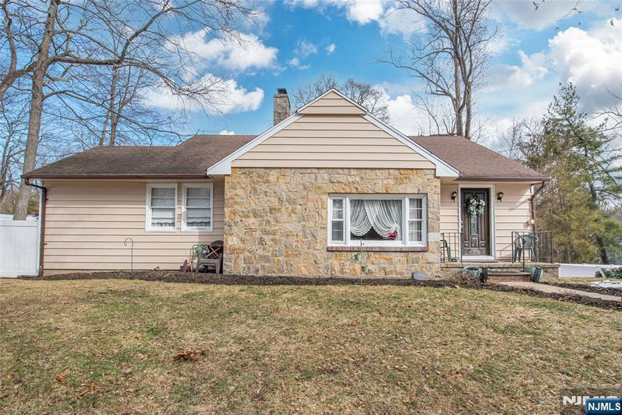 Beautifully updated ranch located in the highly sought-after Pines Lake community in Wayne. This inviting home features a welcoming entry foyer that opens to a spacious sunken living room highlighted by a stunning stone fireplace, creating the perfect gathering space. Just steps away, the formal dining room with a bright bay window fills the home with natural light and offers an ideal setting for entertaining. The home features a renovated kitchen with modern finishes and direct access to a level backyard, perfect for outdoor dining and relaxation. The main level includes a generous primary bedroom, an additional bedroom, a versatile third bedroom or office, and a beautifully renovated main bathroom. Gleaming hardwood floors run throughout the main level. Additional features include a finished basement with ample storage, closets, and laundry area, a one-car attached garage, and a driveway that comfortably accommodates four or more vehicles. Enjoy the lifestyle and amenities of Pines Lake, one of Wayne's most desirable lake communities, offering year-round recreation and a true neighborhood feel.Enjoy the lifestyle and amenities of Pines Lake, one of Wayne's most desirable lake communities. Mandatory lake membership with approximately $100/month association dues.