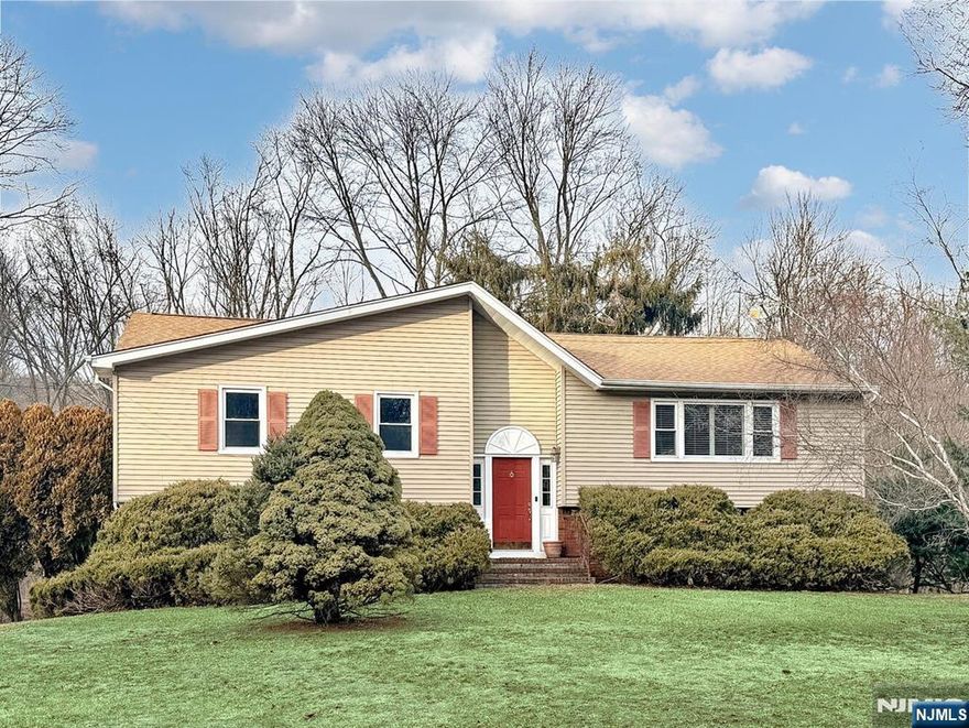 Welcome to this four bedroom, 2.5-bath bi-level located in the desirable Ringwood Acres neighborhood. Set on just over an acre, this home offers a private setting with a rear deck overlooking the spacious backyard. The classic bi-level layout features generous room sizes and a solid floor plan ready to be personalized. You will find three bedrooms, including the primary with en suite, hall bath, living room, dining room (currently used as a sitting area), and kitchen on the main level. The basement features a walk out, fourth bedroom, bathroom/laundry, and family room. With public water and sewer and a well-established location near schools, parks, and commuting routes, this property presents an excellent opportunity to update and create value. A great chance to make this home your own in a sought-after Ringwood community. Professional photos coming soon.