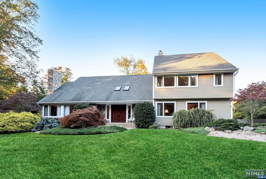 Immaculate & updated colonial with over 4000 sq ft of living space and stunning backyard with pool. This turnkey home welcomes you with a double height ceiling, beautiful hardwood floors & soft neutral palette throughout.The gourmet eat-in kitchen with island overlooks a wonderfully private property with heated saltwater pool, large entertaining deck & level lawn area. A first-floor primary suite (used as family room currently) and first floor laundry make this a home where one can enjoy single level living. Upstairs there are 5 more bedrooms - each with their own ensuite bath. Attached 2car garage. Central air. Cul de sac location. Top rated school district & close to NYC train. Updated inside & out (see brochure). This home is a winner.