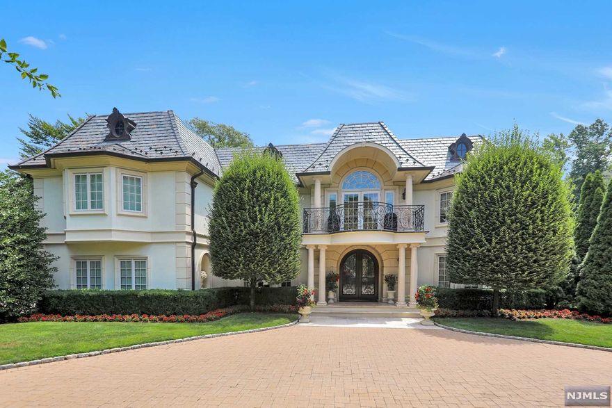 Welcome to 186 Hoover Drive the epitome of luxury and sophistication, where resort like amenities allow for work or play from home. Set high on the hill of Rio Vista, this 5 bedroom 7 bath architectural masterpiece features large formal rooms for entertaining while also offering intimate spaces for cozy family nights. The chefs kitchen with large pantry and breakfast room overlook the covered loggia with views of the fireplace, pool and tennis court.The expansive master suite features vaulted ceiling with access to large terrace, his and her closets, spa like bath with oversized steam shower, radiant heat floor and separate vanities. The upper level is finished with junior suite 2 additional bedrooms a full bathroom and laundry. The lower level is highlighted with a 9 seat theatre, full gym with bathroom, second laundry, storage and bedroom with full bathroom. Easy access to NYC make this paradise a commuters dream.