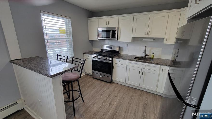 Welcome to this beautifully maintained second-floor, 1-bedroom, 1-bathroom condo in the highly sought-after Valley Terrace Condominiums. This inviting condo offers the perfect blend of comfort, convenience, and modern updates. The spacious living room is filled with natural sunlight and flows seamlessly into the dining area, providing an excellent layout for everyday living or hosting guests. The updated kitchen features modern cabinetry, granite counter-tops, stainless steel appliances, and breakfast bar. The primary bedroom offers a large closet, and the full bathroom has been tastefully updated and includes a large shower, storage vanity, offering both style and functionality. Valley Terrace residents enjoy on-site laundry, parking, access to the pool during the summer and a prime location close to NYC transportation, shopping, dining, and major roadways. Tenant is responsible for electric and cable/internet, all other utilities are included in the rent. Ready for immediate occupancy - schedule your tour today and take the next step toward making this beautiful condo your new home!