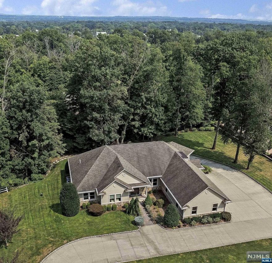 Stunning custom built ranch on one acre lot in upscale Buckingham Estates. 3,488 square feet of one level living with elevator service to basement and second level having an unfinished attic with finishing potential. Three car garage on grade and an additional 4 car tandem garage built-in. Natural gas direct generator. Public water and well on property for irrigation and kitchen. High end finishes. Radiant heated floors throughout, 9' ceilings, trey ceiling in dining room, great room and primary suite, crown moldings, granite, wood floors, stainless steel appliances, butler's pantry....the list goes on and on. Tremendous eat-in kitchen with separate eating area and center island with breakfast bar, walk-in pantry, formal dining room and great room. Primary suite with two custom walk-in closets, dressing area, full bath with jetted tub, shower stall, two vanities and private commode. Three additional bedrooms, one currently used as an office, full bath, powder room, laundry room a