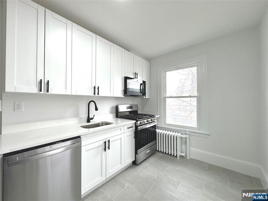 Fully renovated 3-bedroom rental just completed! This unit features a brand-new kitchen, bathrooms, flooring, and fresh paint, along with an in-unit full-size washer and dryer. Each spacious, sunlit bedroom includes a remote-controlled ceiling light with adjustable brightness and a generously sized closet. The walk-up attic offers two versatile dens, perfect for a home office or gym. Conveniently located within 5 minutes of downtown and major highways, with a bus stop right in front of the home providing access to Manhattan in under 40 minutes. The tenant is responsible for all utilities. Upon signing the lease, the first monthâ€™s rent, a security deposit of 1.5 monthsâ€™ rent, and a broker fee equal to one monthâ€™s rent are required.