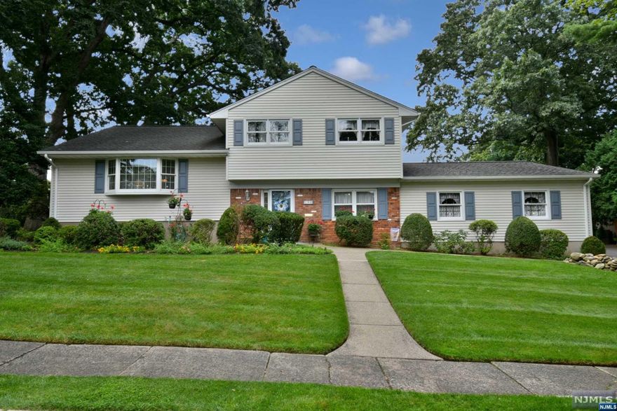 Impressive 4-bedroom, 2 bathroom home in desirable Midland Park. Large lot size, with beautiful patio, gazebo, 2-gardens, shed and perfect backyard for entertaining. Eat-in kitchen with beautiful views to backyard, leads to dining room and living room on main level. Both dining room and living room have hardwood floors under carpet. Large primary bedroom with ample closet space, and 2-additional bedrooms on upper level---4th bedroom on lower level. Both full bathrooms are renovated and large. Semi-finished basement is an added bonus. Property is lushly landscaped with lots of privacy. Do not miss this excellent opportunity!