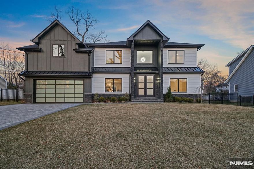 Experience luxury in this newly built 7-bedroom, 5-bathroom modern colonial. Grand double doors lead to an elegant entry foyer with a stunning chandelier. The open floor plan flows from the living room to the dining area, featuring backyard views, and into the family room with a floor-to-ceiling porcelain-wrapped fireplace. The gourmet Italian Pedini kitchen boasts high-end stainless steel appliances, sleek cabinetry, and a statement chandelier. The first floor also includes a bedroom and a stylish full bath with natural wood accents. Upstairs, the primary suite offers an ensuite spa bath, dual sinks, a soaking tub, and a stall shower. Two bedrooms share a Jack and Jill bath, while a junior suite features a private bath. The fully finished basement provides a nook, rec room perfect for a home theater or gym, and 2 bedrooms with a Jack and Jill bath. Owner holds R.E License. Options to extend the primary bedroom and closets, inquire with our team.