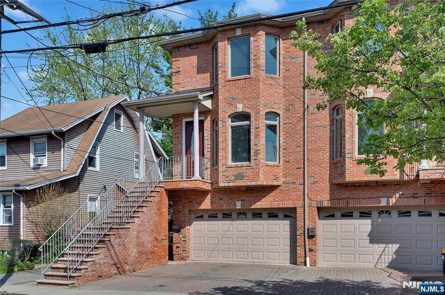 Beautiful, sunny, and airy attached duplex featuring gleaming wood floors, 9-foot ceilings, and a bright living room with a gas fireplace, skylight, and elegant crown molding. The spacious kitchen is equipped with granite countertops and brand-new, top-quality appliances, ideal for both everyday living and entertaining. With 2 garage parking spaces and 2 additional outdoor spots, thereâ€™s room for everyone. Bonus: the home also includes a separate ground-floor entrance, offering added flexibility and privacy. Conveniently located near NYC transportation, shops, and parksâ€”this home truly has it all.