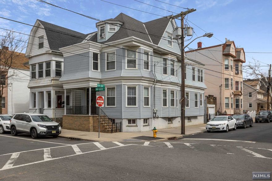 Welcome!!!! OUR PERFECT HOME WAITS FOR YOU!!! Unique, charming, and located at the corner of Van Buren and New York Avenue, facing Independence Recreational Park.This two-family home is perfectly positioned to take advantage of what the sought-after Ironbound section has to offer. Everything is just steps from your door. The Ironbound Restaurants/Ferry Street / Pulaski Street Shopping Stores /Nightlife. The first-floor Apartment features a Bi-level style Kitchen-Living /Dining room with Beam ceiling , three bedrooms, a full bath, Second Floor Apartment bi-level style Kitchen Living room, two bedrooms, a full bath, carpet, and tile floors throughout, plenty of closet space. Finished Basement. Exterior: Vinyl Siding, Garage, and Driveway on New York Avenue