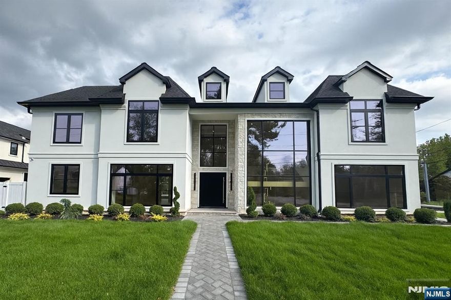 New Construction French modern masterpiece set on a dead end street in the north cliffs, spanning over 9200 sqft of modern luxury. 7br, 6bath, 2 half bath. Featuring 10' ceiling first floor and 9' basement & second floor, incredible oversized European windows, radiant heat throughout & open floor plan. Outdoor with in ground gunite pool with spa. Main level offers living room, dining room, guest bedroom with full bath, a grand open-concept Chef's Kitchen Sub Zero / Wolf appliances with Italian cabinets, prep kitchen, two story great Room, mud room. The 2nd level offers 4 bedrooms, each with en-suite bathrooms. Primary suite features sitting room with fireplace, double must see custom walk-in closet's & spa-like bath and laundry room. Amenity-filled basement with gym, home theater, wet-bar, REC room, wine room, secondary laundry room, 2 guest bedroom, full bathroom & half bath. 3 car garage radiant heated, smart functionally throughout. Owner = LIC RE.