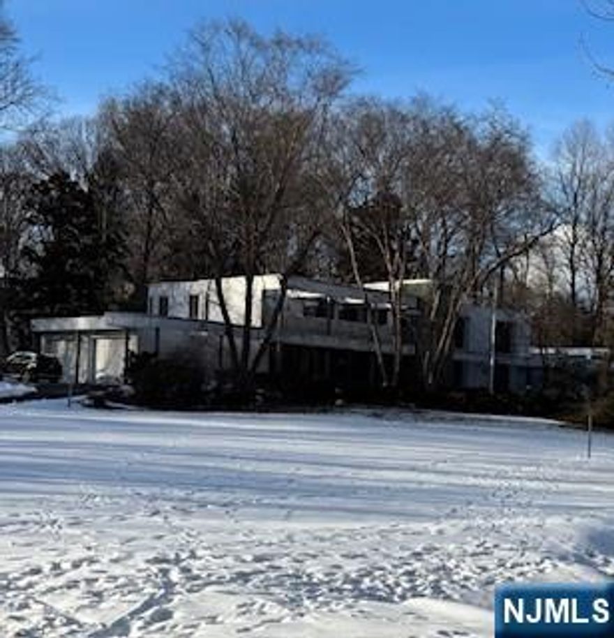 Contemporary on beautiful flat two acre property w/pond, indoor & outdoor pools. Four car garage. Home needs TLC, being sold strictly "as is", buyer responsible for obtaining CO