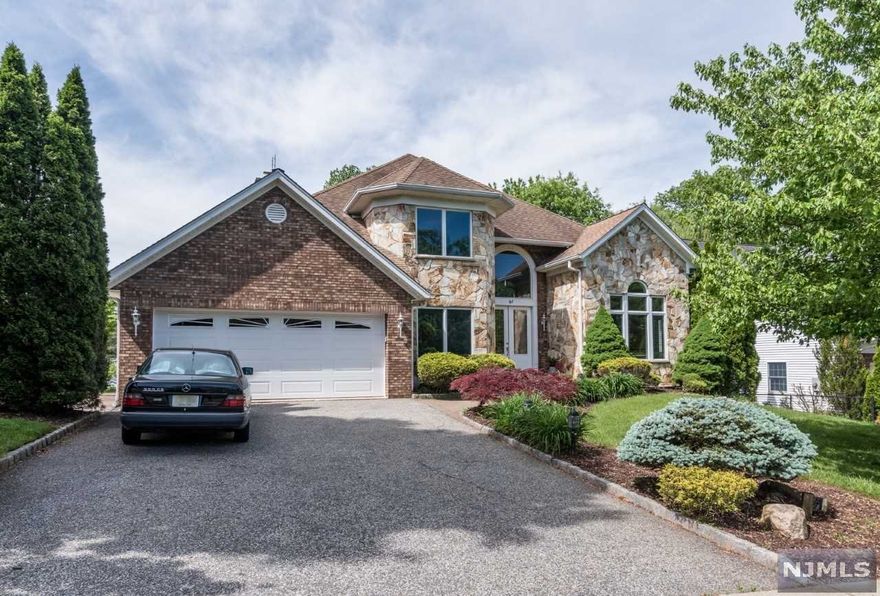 THE ONE YOU'VE BEEN WAITING FOR! DESIRABLE MONTCLAIR HEIGHTS LOCATION W/ EASY ACCESS TO NYC TRANSPORTAION. CONVENIENTLY LOCATED NEAR SCHOOLS, PARKS, RT 3, RT 46 & GSP. QUALITY CONSTRUCTION AND FINISHES INCLUDE STONE & BRICK EXTERIOR, 2 STORY FOYER, 8 FT INTERIOR DOORS ON MAIN LEVEL, VOLUME CEILINGS, HARDWOOD FLOORS THROUGHOUT, 6Z GAS HWBB HEAT & 2 Z CENT AIR. SPACIOUS KITCHEN FEATURES STAINLESS BOSCH APPLIANCES, MARVEL WINE FRIDGE, CENTER ISLAND AND LARGE WALK-IN PANTRY! FAMILY ROOM HAS A WOOD BURNING FPL AND ACCESS TO DECK. 2ND LEVEL OFFERS HARDWOOD FLOORS IN ALL BEDROOMS. MAIN BEDROOM BOASTS 2 LARGE WALK-IN CLOSETS, & LARGE BATH. LOWER LEVEL LENDS ITSELF TO MANY USES WITH TILE FLOORING IN BAR ROOM & SITTING AREA AND RECENTLY NEW BATHROOM WITH SHOWER. HUGE 16X36 EXCERCISE ROOM WITH COMMERCIAL QUALITY ECOVERT GYM FLOORING IS MIRRORED AND HAS SLIDERS TO BACKYARD. GARAGE W/EPOXY FLOORS ENTERS TO MAIN LEVEL OR BASEMENT. SO MANY DETAILS, THIS HOME IS A MUST SEE!