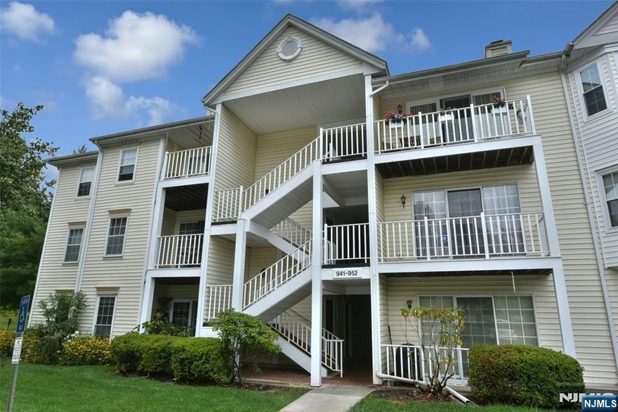 Rare First-Floor End Unit with Private Patio â€“ Move-In Ready! Donâ€™t miss this opportunity to own a true first-floor end unit in Mahwahâ€™s sought-after Society Hill. With no stairs, easy access, and a private patio overlooking peaceful woods, this meticulously cared for condo offers the perfect mix of comfort, style, and convenience. Step inside to a spacious living room, a full dining area, and an updated kitchenâ€”perfect for entertaining or everyday living. With wood floors throughout, abundant natural light, and a seamless flow to the outdoor space, this home feels bright and welcoming. The layout includes two large bedrooms and two beautifully renovated bathrooms. The primary en-suite features a custom walk-in closet, a second closet, and a modern bath with a walk-in shower. Recent upgrades include new central air, in-unit washer and dryer, six-panel solid wood doors, custom blinds, and new three-panel sliding doors to the patio. A large storage unit is conveniently located just outside your front door. Some of the amenities to enjoy: pool, tennis courts, clubhouse, and playground. You have an assigned parking spot and plenty of guest parking. Pets are welcome! With top-rated schools, low taxes, and easy access to NYC, hiking, and skiing, this home is ideal for downsizers, first-time buyers, or anyone seeking low-maintenance luxury. This rare first-floor end unit wonâ€™t lastâ€”schedule your showing today!