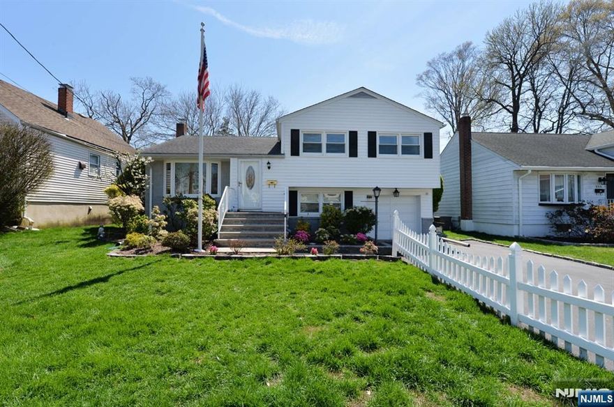 Lovingly maintained split level in super clean condition! Large living room and entertainment sized formal dining room with sliding glass door to deck . Eat in kitchen. Upstairs features three good sized bedrooms and full bathroom. Den and full bath with access to rear yard and garage on ground level. Full unfinished basement with high ceiling and loads of potential! Central air. A must see to appreciate this lovely home!