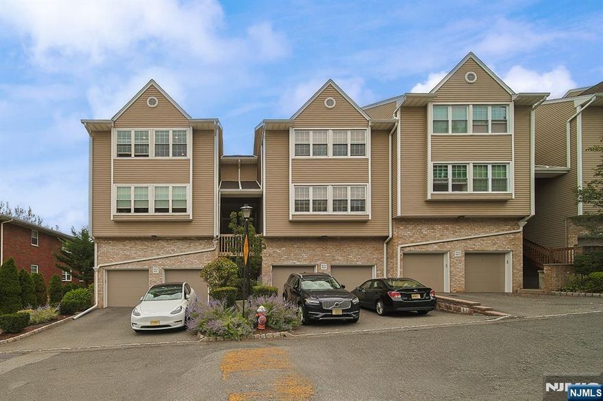 Step into this beautifully maintained townhouse featuring soaring high ceilings in the living room that create an open and airy atmosphere. The private balcony offers stunning views, perfect for relaxing or entertaining. This spacious home includes 3 bedrooms, 2.5 bathrooms, and approximately 1,853 sq. ft. of comfortable living space. The modern kitchen comes with updated appliances and connects seamlessly to the dining area. The primary suite provides a full bath and ample closet space. Additional highlights include hardwood floors, in-unit laundry, central air, and an attached garage with extra storage. Ideally located near schools, shopping, parks, and major highways, with quick access to New York City. A true move-in ready homeâ€”donâ€™t miss this opportunity!