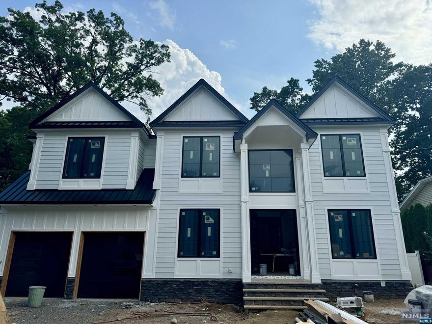 Welcome to 200 Homestead Rd, a stunning new construction home in prime Paramus. Upon completion, this center hall colonial will boast over 5000 sq ft of luxury living space, with 5 bedrooms, 5 full baths, and 2 half baths. The main level will feature an open floor plan, chef's kitchen with high-end finishes, guest bedroom w/ full bath, access to the 2 car garage, making this home perfect for both casual living and entertaining. The second floor offers 4 bedrooms and 4 full baths. The fully finished basement w/ half bath offers a flexible extended living space adding opportunities to create a home gym, movie theater, etc. All this and so much more set on a beautifully landscaped 1/4 acre flat lot, offering the ultimate in modern elegance. Don't miss the chance to experience luxury living at its finest. See more photos of comparable home (36 Alden Rd. Paramus) completed by the same prominent builder. Schedule your viewing today!