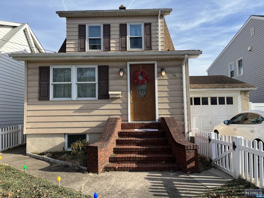 Renovated (8years age) and nicely maintained colonial in very desirable Lakeview section of Paterson. 2BR plus bedroom/office. The lower level has walk in closet & bath. Newer gas boiler, refinished hardwood floors, entry foyer, newer appliances, LR, workroom, energy saving features, garage, separate exit to the large private backyard for lots of family fun! MUST SEE