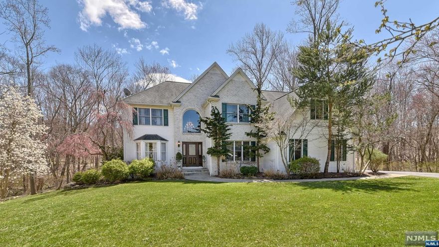 Remarkable Colonial home situated in a premier cul-de-sac location, surrounded by the tranquility of 1.3 acres. Boasting 5 bedrooms and 2.1 baths. The dramatic 2-story foyer seamlessly transitions into living room with an adjacent dining room, creating an ideal setting for entertaining and gatherings. Beautifully appointed Kitchen featuring a custom island, SS appliances and granite counters. Kitchen flows into the great room, highlighted by a wood-burning fireplace. The stunning conservatory provides a serene atmosphere flooded with natural light. The main flr includes a bedrm, powder rm, and laundry rm and garage access. Expansive Primary suite, separate sitting rm, WIC, and an en-suite bath. Three add'l bedrms and main bath complete the 2nd flr. The finished basement adds versatility to this home, providing a spacious area and ample storage, perfect for a home theater and playroom. Add'l features; hardwood flrs, deck, multi-zone heat and air, an UGS system, and a 2-car garage