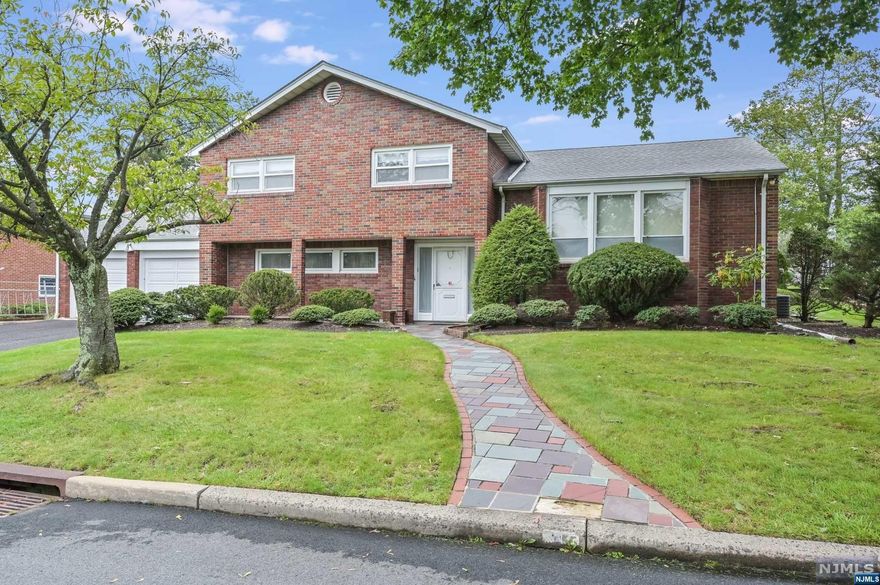 This lovingly maintained, south facing home features a sun filled living room with a vaulted ceiling, formal dining room and a bright eat-in kitchen on the main level. A primary suite and two additional bedrooms complete the second floor. The ground floor offers a fourth bedroom and a family room that opens to the level and private yard. There is also a full basement with two rooms and laundry. Other notable features include hardwood floors, brick exterior and manicured property. Just a short walk to NYC buses, Upper School, fine dining, town parks and recreation. This is a great opportunity to buy a quality home in a sought after location.