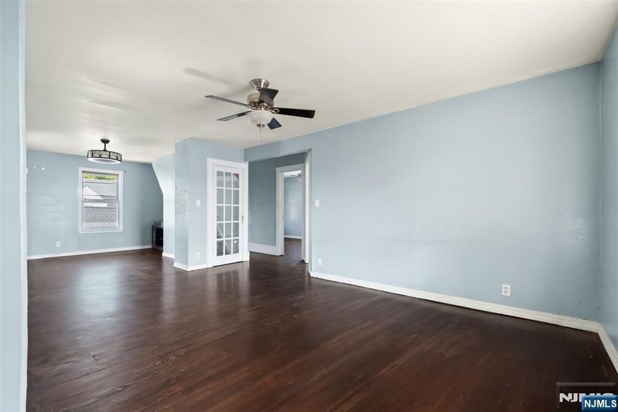 Welcome to this spacious 3-bedroom, 1.5-bathroom duplex apartment located in the desirable Fairmount section of Hackensack. Upon entering the first floor, you'll be greeted by beautiful hardwood floors that extend throughout the living area. The updated kitchen is a chef's delight, featuring stainless steel appliances including a dishwasher, gas stove, refrigerator, and a built-in microwave. The three nicely sized bedrooms on this level are equipped with ceiling fans for your comfort. The full bathroom is a true retreat with a jetted tub, a separate stand-up shower, and a double vanity. The second floor is a unique and versatile space, offering a fully finished attic complete with a convenient half bathroom. This area is perfect for a home office, a family room, or an extra bedroom. Conveniently located at 125 Coles Ave, this apartment provides excellent transportation options for commuters. The Hackensack Bus Terminal is a 6-minute drive away, offering bus services on NJ Transit routes 76, 83, 158, 162, 165, 168, and 182. Additionally, the Essex Street NJ Transit train station is a 7-minute drive away, with service on the Pascack Valley Line. For those who prefer to drive, the property is situated just minutes from Route 17 and I-80, providing easy access to major highways.