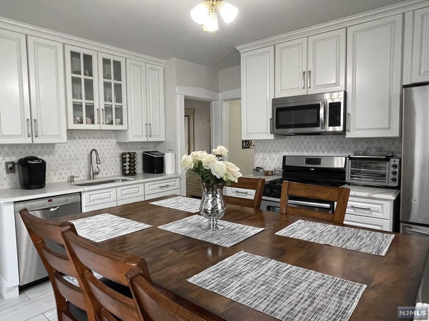 WOW!!! Don't miss this beautifully renovated 2 family with NYC views! Why rent when you can buy, this 6 bedroom, 2 bath, 2 deck home with 2 car garage, very long, wide driveway and yard, rent out one and live in the other unit for much less!!! Separate utilities. You will love relaxing in this beautiful home, indoors or outdoors after a long day! Not to mention the bonus investment opportunity!!! Hurry, this one will not last!