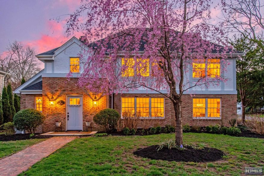 Situated on one of Montclair's most idyllic streets, this newer tudor features many of the most desired features in a suburban home: Kitchen overlooking family room with fireplace, large scale rooms, first floor office (or 4th bedroom), indoor-outdoor living with generous deck, superb, open basement with 9 ft ceilings, 2 car garage plus room for bikes and workshop, picturesque landscaping on flat back yard. Conveniently located just steps from NYC transporation yet quiet, low-traffic street shaded with mature oak trees.