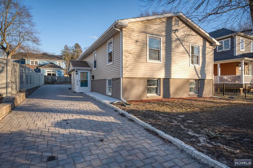 Highly Sought After RAISED RANCH! Fully Renovated & Modern. Open Floor Plan offers One Floor Living with over 2200 Sq Ft of Living Space . Main Level consists of an Open Floor Plan Living Room, Dining Room & Kitchen, Master Bedroom with en Suite, 2 Additional Bedrooms and Main Bathroom. Lower Level consists of Large Family Room/Den area with additional Room for Office/Study & 3rd Full Bath and Laundry. Perfect for guest suite. Home was just renovated with all New Hardwood Floors on Main Level, New Vinyl Flooring on Lower Level, New Kitchen & Appliances, 3 New Bathrooms, New Siding & New Paver Driveway with Parking for 6+ Cars. Conveniently located close to Englewood Hospital, Shops, & Restaurants. A Commuters dream with Bus to NYC right across the street.