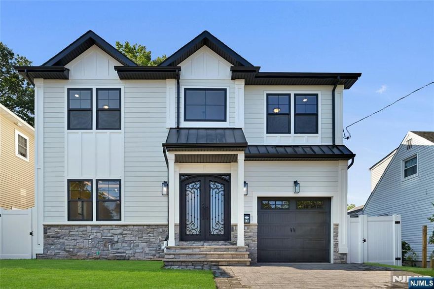 Beautiful new construction available in wonderful Bergenfield location. Stunning sidehall colonial with two story entry, formal living room and dining room, double appliance eat in kitchen with gorgeous cabinets and quartz countertops. Large pantry and mudroom off attached garage. Walk in Pantry also has kitchen access. Family room with gas fireplace and powder room complete first floor. Second floor has primary suite with full bath, four additional bedrooms and two full baths, plus laundry. Incredible basement w/ large playroom with wetbar and wine fridge. All custom closets, hardwood floors, ug sprinklers, full house generator, 2 zone ac, 3 zone heat, great curb appeal. Close to all.