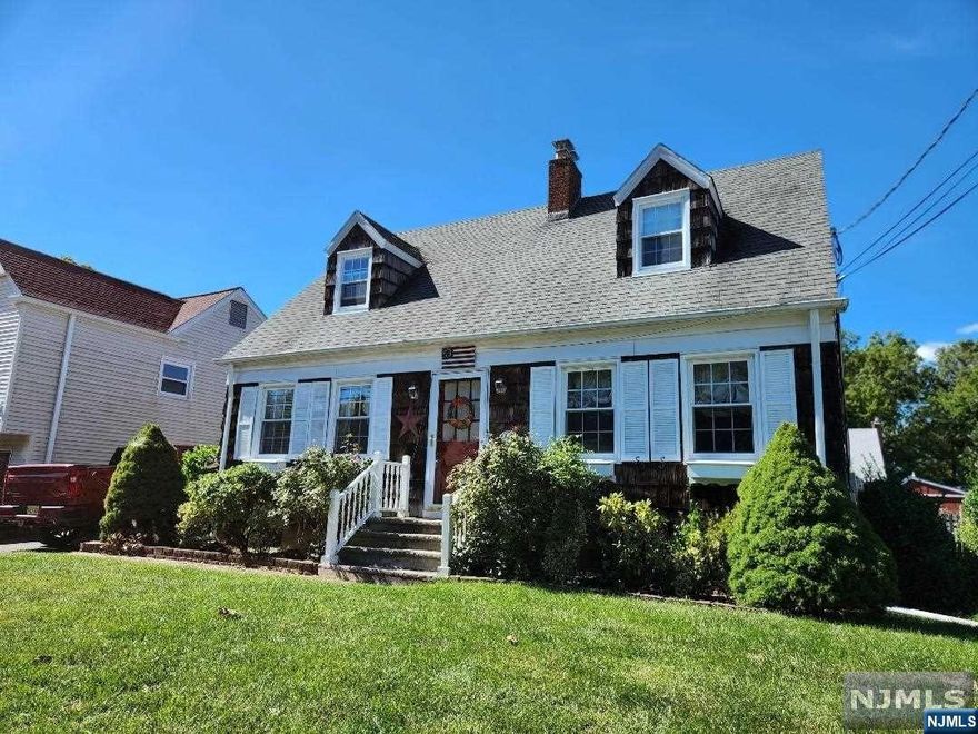 Curb appeal galore! This expanded home is situated on a quiet street in the Graphic Boulevard section of Bergenfield. Lovingly maintained upon entering this charming home you will be greeted by the oversized formal living room with gas fireplace. Entertainment sized formal dining room. Good size eat in kitchen with convenient side door to driveway. Oversized family room/master bedroom addition with full bathroom and access to patio and rear fenced yard. Detached garage. Central air. Unfinished basement with high ceiling offers much potential to finish. Upstairs boast two more bedrooms with loads of closet space and a full bathroom.