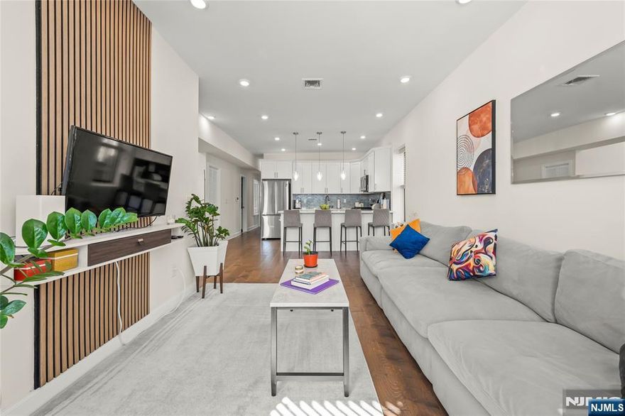 Step into a beautifully renovated three-bedroom, two-bathroom condominium in the desirable Heights neighborhood of Jersey City. This 1,100-square-foot residence on the second floor of an intimate two-unit building is the perfect alternative for those wanting to escape Manhattan and Brooklyn's high prices without sacrificing accessibility or quality of life. Inside, you'll find a completely refreshed interior with contemporary finishes. The central HVAC system with smart thermostat technology ensures effortless climate control and predictable utility costs. The kitchen features smart appliances, and an in-unit full-size washer and dryer eliminates the need for laundromats. With two full bathrooms and three generous bedrooms, there's ample space for remote work, guests, or simply spreading out. Location is a major highlight for NYC commuters. The Journal Square PATH station is just moments away, providing direct access to the World Trade Center. Bus routes on Palisade Avenue and Central Avenue offer additional convenient options to reach Midtown and Downtown Manhattan, saving you precious time. Despite this exceptional connectivity, 21 Concord Street offers a peaceful retreat on a quiet, tree-lined street. You'll experience a genuine neighborhood feel while building equity and enjoying more space at a lower cost. This is Jersey City living at its finestâ€”where smart location meets thoughtful renovation and your housing dollar goes further.