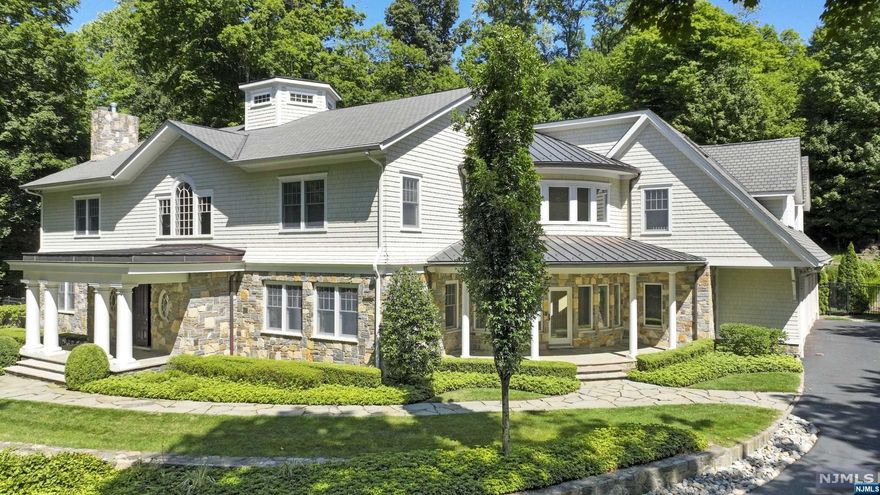 Nestled on over 2 tranquil acres, this gated East Hill Saddle River home combines all of the most coveted amenities over 6,700 sq ft of exquisite living space. The interior of the home feat 6 BRs, 10 baths & a resort-style yard w a heated in-ground pool & a full service cabana. The first level offers a lavish open-concept design, a two-story foyer & family room, gourmet chefs eat-in kitchen, butlers pantry, mud room, office suite & a first level solarium that offers extensive views to the front courtyard, offering exceptional convenience as the home's informal entrance. The upstairs level feat the primary suite w two custom closets & a spa-like en-suite bath. The 2nd Fl balcony leads to the opposing wing of the home feat 4 BRs, each a full bath. The interior of this home is complete w a 3,000 sq ft finished BM that provides a theater, fitness center, mirrored studio, wet bar/kitchenette, an addl BR, two full baths, Control4 system, Sec System, Generator & a 3 car garage.