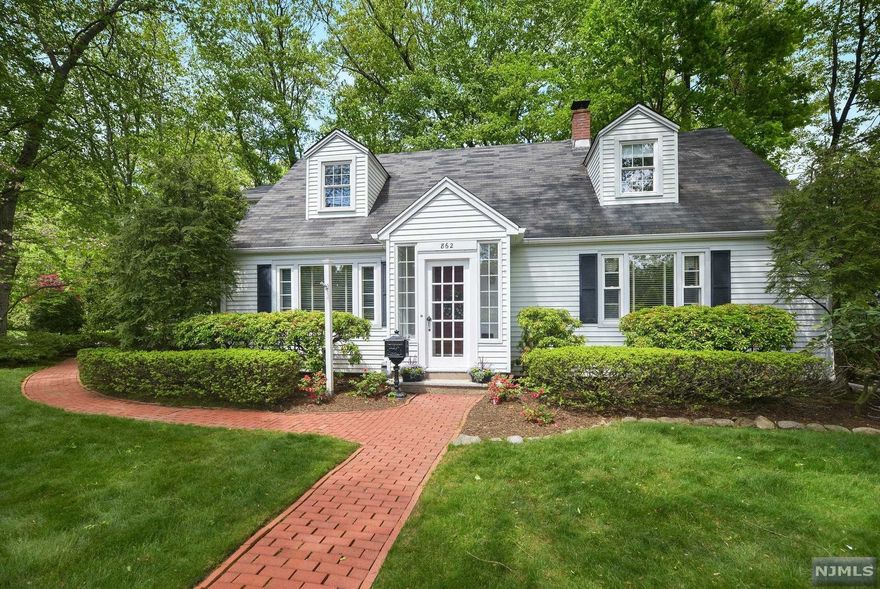 Absolutely charming and immaculate 3-bedroom, 2 full bath colonial cape cod located in one of Oradell's most desirable areas. Step into an all-glass vestibule entry foyer, large living room, formal dining room and updated kitchen with stainless steel appliances, granite counters and an all window breakfast area. Welcoming Den w/ built in cabinet, full hall bathroom and nice size bedroom. 2nd floor has and generous size primary bedroom w/ 2 closets, one a walk in and a welcoming all glass sitting area perfect for reading and overlooking the yard. 2nd very oversized bedroom and full hall bathroom completes the 2nd level. Very private landscaped backyard w/ paver patio perfect for entertaining. Unfinished basement with laundry. Hardwood floors throughout, Newer hot water heater, short distance to NYC transportation via bus and train, schools, parks, shopping, and all major highways.