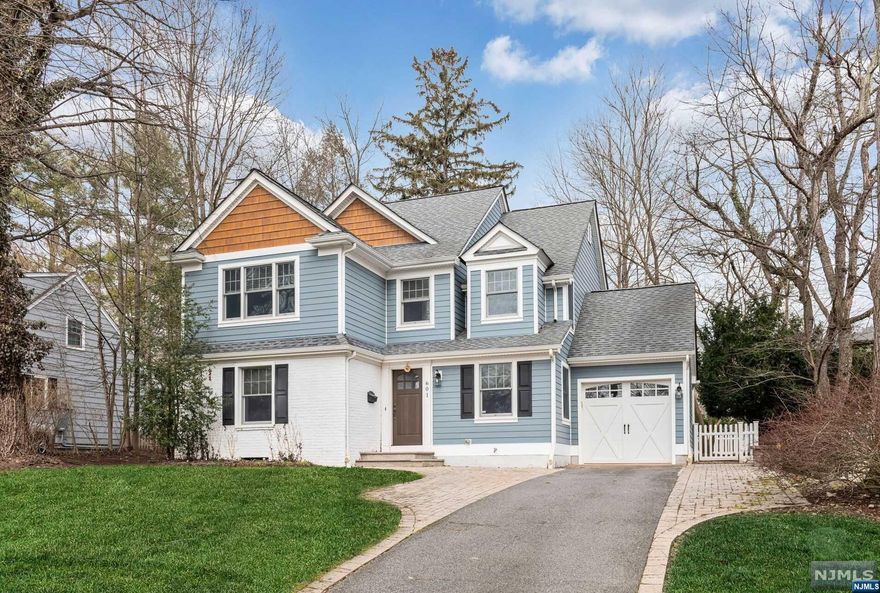 Looking for a wonderful COLONIAL in one of the most DESIRED TOWNS in Bergen County. Look no further! This home was rebuilt from the foundation in 2008! The first floor has an Entry Foyer which leads to a large Living Room with a gas fireplace and built in bar area. The Eat in Kitchen has a center island and Dining Area with french doors leading to a paver patio and fenced yard. The first floor is complete with a formal Dining Room, Powder Room and Mudroom/Laundry Room. The second floor has an expansive Primary Bedroom with a vaulted ceiling, 2 walk-in closets and Primary Bathroom. 2 additional Bedrooms, Office and a Full Bath complete the second floor. The Basement is fully finished for your enjoyment with storage space. Additional features include inground sprinklers, central vac, new stove and hard scraped wood plank floors. Close to School, Town and NYC transportation. Make this your home today!