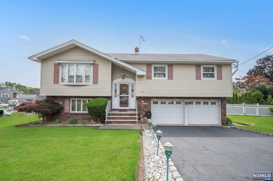 Situated on a desirable quiet cul-de-sac just minutes away from "everything", shopping, major highway, restaurants and just a short trip to New York City. Upon walking up to the entrance, you will see the thoughtfully landscaped grounds, which invite you into the front yard. Upon Entering, you are greeted by an entry landing, and up the stairs to the main floor which boasts the Kitchen, Formal Dining Room and large Living Room. Just down the hall there are 3 Bedrooms, one being the Master Bedroom with Master Bath. Just a few steps away, downstairs you will find the Family Room, with a Kitchenette and 1/2 Bath. The sliding glass doors will bring you onto the back Patio, which provides plentiful space for gardening and entertaining. Don't miss this opportunity!