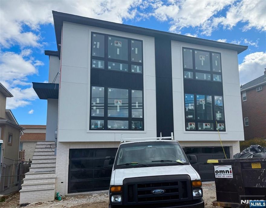 Beautiful modern new construction new foundation unit in the heart of Palisades Park. This residence offers unprecedented space, comfort, and modern design. The unit includes 3 floors of living with a spacious living room with a gas fireplace on the first floor, a formal dining room, a modern kitchen, half bath and ample patio space. On the second floor, you will find a primary suite complete with a master bath, two additional bedrooms with full bath, and a laundry room. The fully finished ground floor features a den/office, an additional room, a full bathroom, and separate entrances, providing extra living space. The unit also has its own private driveway and a two-car garage. Close to parks, highways, shopping, and schools. Taxes are to be determined. The construction will be done in beginning of 2026. There is time to chose your own colors! Don't miss this incredible opportunity to live in a brand new modern unit! Please see floor plan in photos.