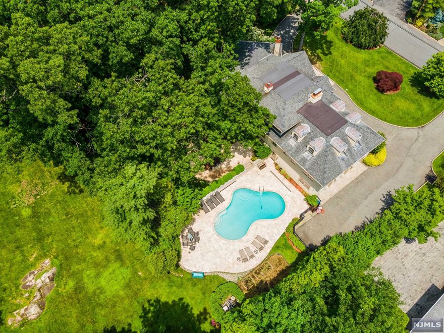 CUSTOM CONTEMPORARY W/6 BDRMS,5.5 BATHS,3-CAR GARAGE & IN-GROUND POOL ON NEARLY AN ACRE IN THE PRESTIGIOUS EAST HILL.LOCATED A FEW MINUTES FROM THE GWB, TOP RATED SCHOOLS,SHOPPING,DINING & PARKS.ENOUGH SPACE FOR COMFORTABLE LIVING & ENTERTAINING.DOUBLE GLASS MAHOGANY DOORS LEAD YOU INTO THE FOYER W/19-FOOT CEILING & POWDER RM, A SPACIOUS LIVING RM W/ ONYX STONE FIREPLACE & GRAND DINING RM. FAMILY RM W/A WOOD FIREPLACE, OPEN KITCHEN W/CUSTOM CABINETRY, STONE COUNTERS, WOLF & SUB-ZERO APPLIANCES & AN OVERSIZED ISLAND. BREAKFAST NOOK OPENS TO A DECK THAT OVERLOOKS A TRAVERTINE PATIO,OUTDOOR KITCHEN & FIRE PIT.THE MAIN LEVEL CONTINUES W/A FULL HALL BATH & 3 LARGE BDRMS. THE 2ND FL HAS A PRIMARY BDRM SUITE COMPLETE W/FIREPLACE, WIC & A SITTING AREA W/ A PRIVATE BALCONY.THE EN SUITE BATH HAS HEATED FLOORS, STEAM SHOWER & JACUZZI TUB. LOWER LEVEL HAS A SPACIOUS REC ROOM, FIREPLACE, FULL BATH & WALKOUT TO THE POOL.2 BDRMS & LAUNDRY ROOM COMPLETE THIS LEVEL. A RARE & ELEGANT FIND!